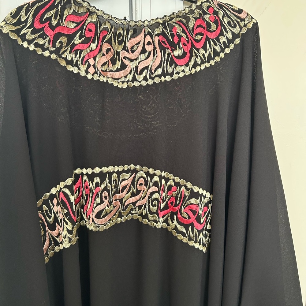 Elegant Black Dress with Red and Gold Detailing